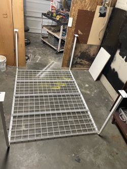White metal overhead garage storage unit