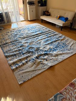 Large gray and blue rug/carpet