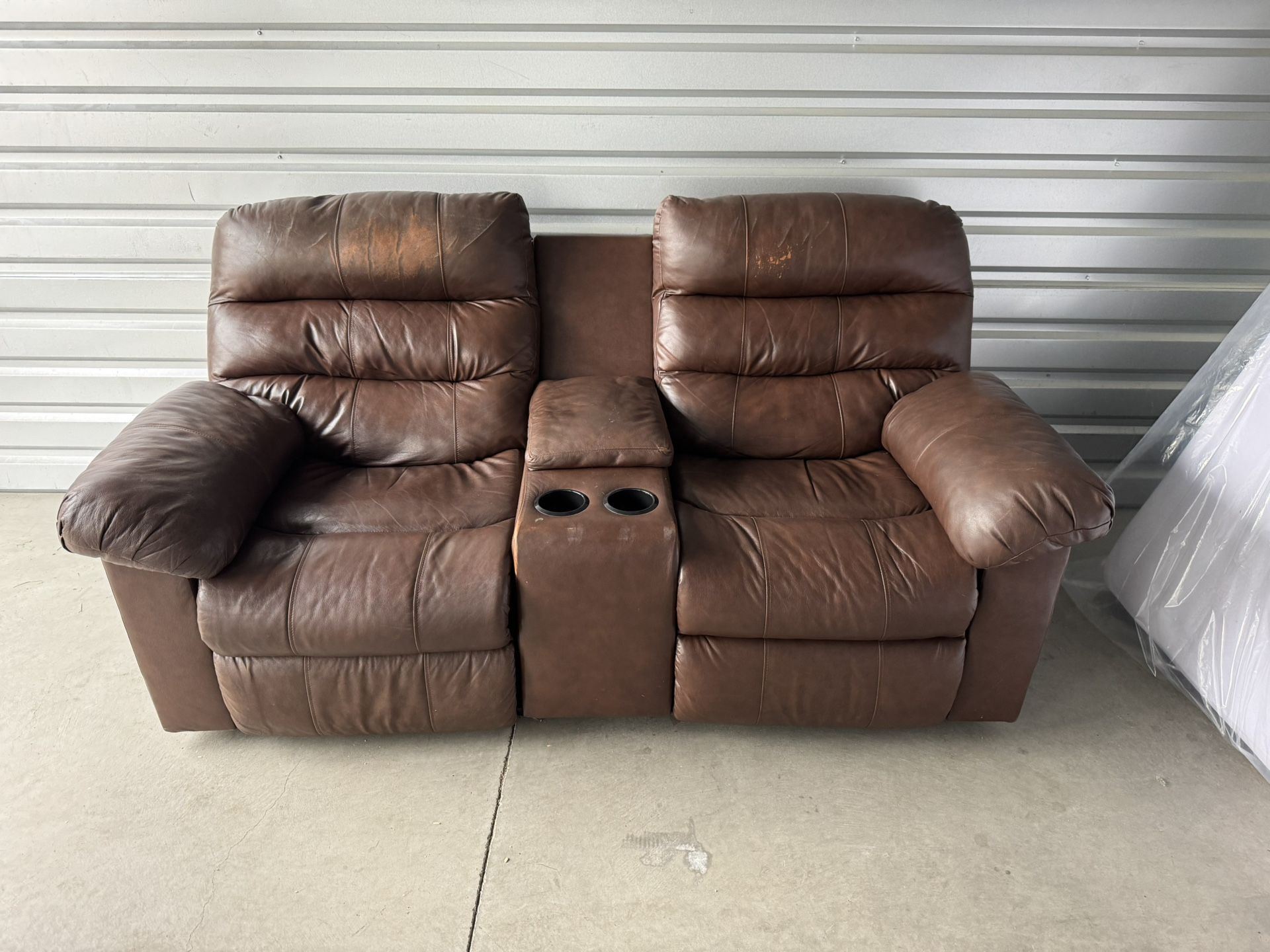 Brown Leather Reclining Loveseat with Center Console & Cup Holders