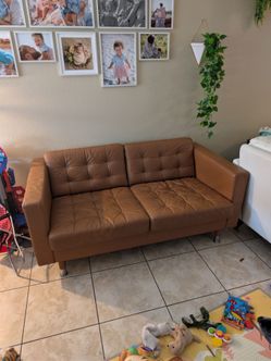IKEA Landskrona 2-seat sofa, tan/cognac leather. 66"W x 38"D x 28"H.