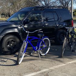 Bikes 1 Blue Beach Cruiser And 1 Black