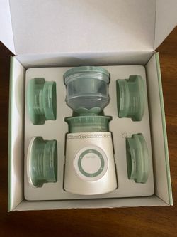 Momcozy travel bottle warmer
