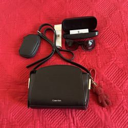 New Calvin klein over the shoulder ladies body bag . Bonus new ladies Calvin Klein sun glasses. 25$.