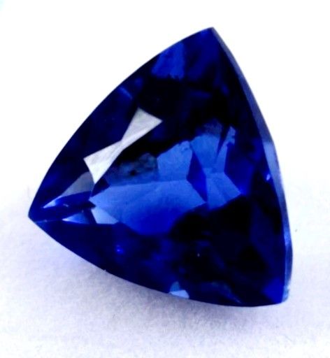 6.40 Ct Loose Dark Blue Zoisite Tanzanite-Like Excellent Trillion Cut Gemstone. The product is a 6.40 Ct loose dark blue Zoisite Tanzanite-like gemsto