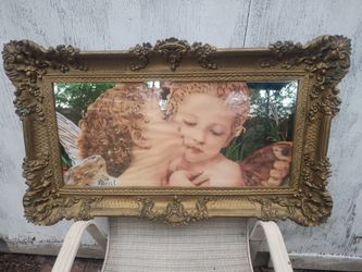 Kissing cherubs image on mirror glass