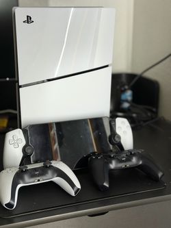 PlayStation 5 digital slim, two controllers and PlayStation portal