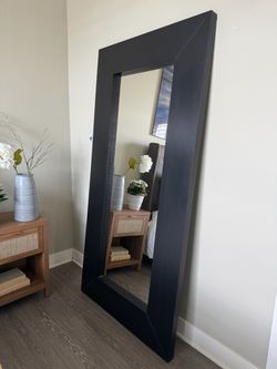 Large dark wood framed mirror