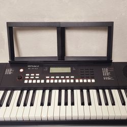 Roland E-X10 Arranger Keyboard with Music Rest and Power piano
