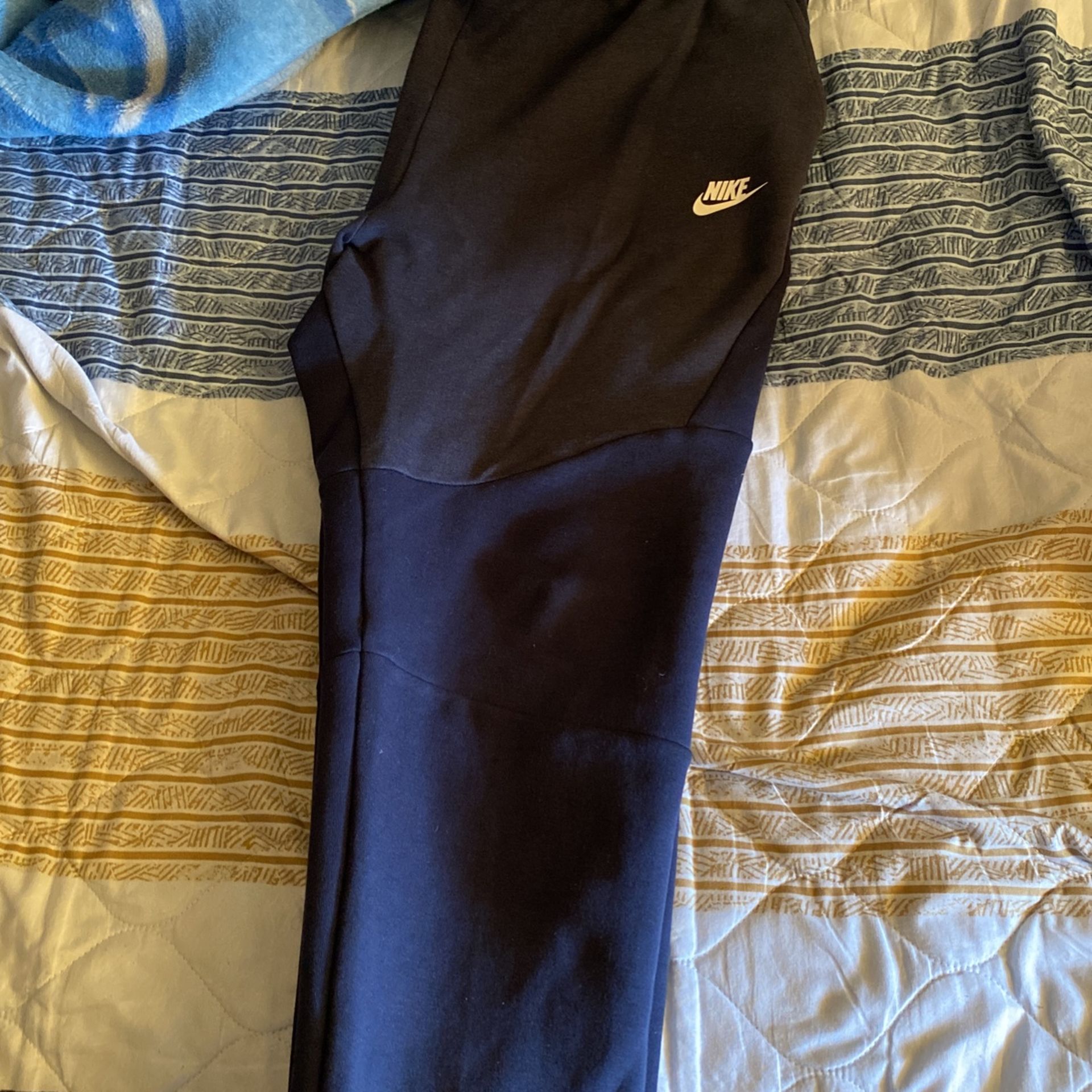 purple nike tech pants