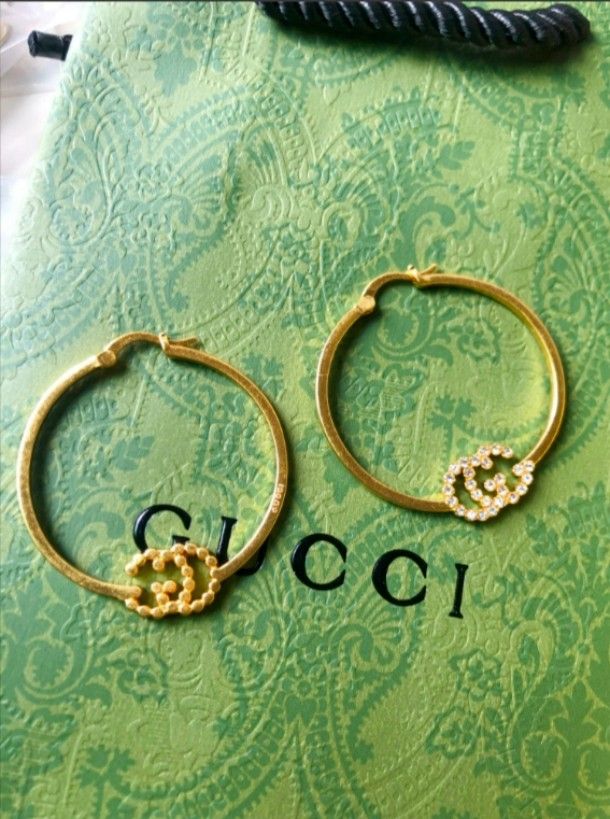 Gold - Tone Hoop Earrings with Iconic Detail