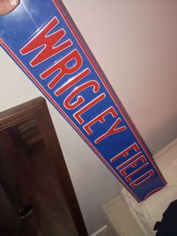 Chicago Cubs stadium name on metal plack. "Wrigley Field"