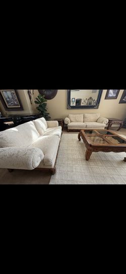 White couches and brown table set