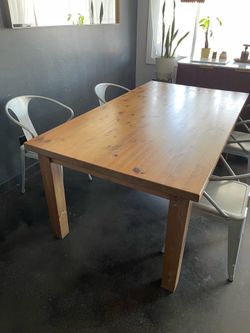 Sturdy solid wood table and chairs.