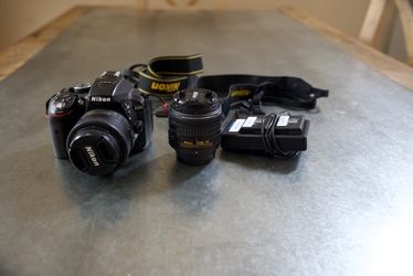 Nikon D5300 with two lenses, 3 batteries and 2 straps