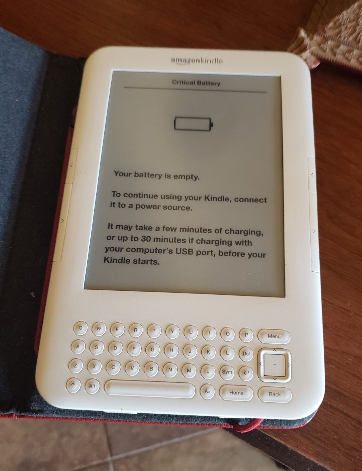 Amazon Kindle with red leather case