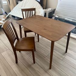 Wood table and two chairs