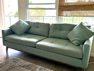 Cute beachy light green couch