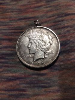 1928 liberty head silver dollar with bale so it can be hung from a chain