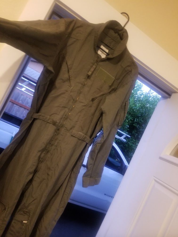 Military coveralls....pants ...jacket ...shirts ...rain poncho and duffle bag.