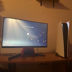 Playstation 5 with controller and monitor