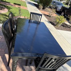 Black hardwood Table and 4 Chairs