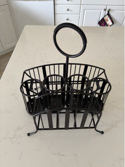 Caddy for silverware, plates, napkins.
