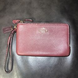 Coach Burgundy wristlet with two zippers 