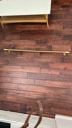 Gold colored curtain rod