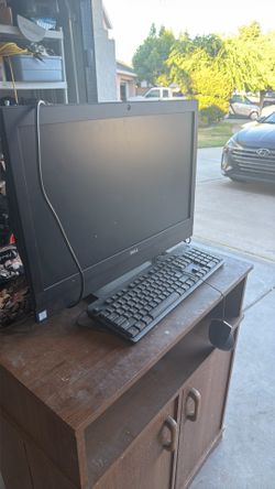 Dyson vacuum, a touchscreen dell computer and a 32 inch TV