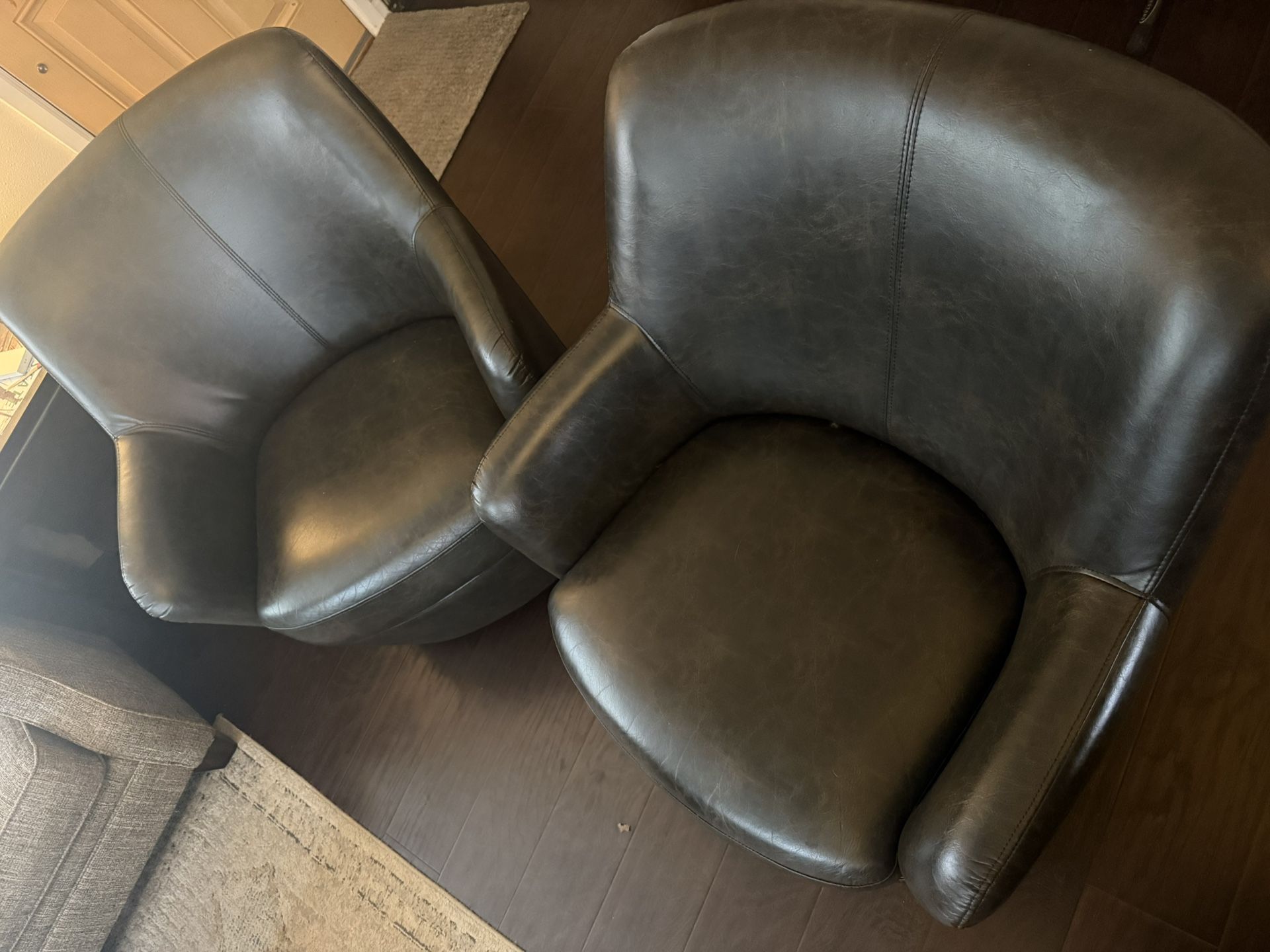 2 Leather Swivel Chairs