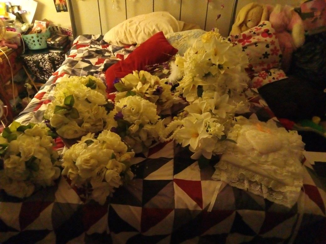 Several Flowers That Never Got Used For A Wedding And The Wedding Photo Book