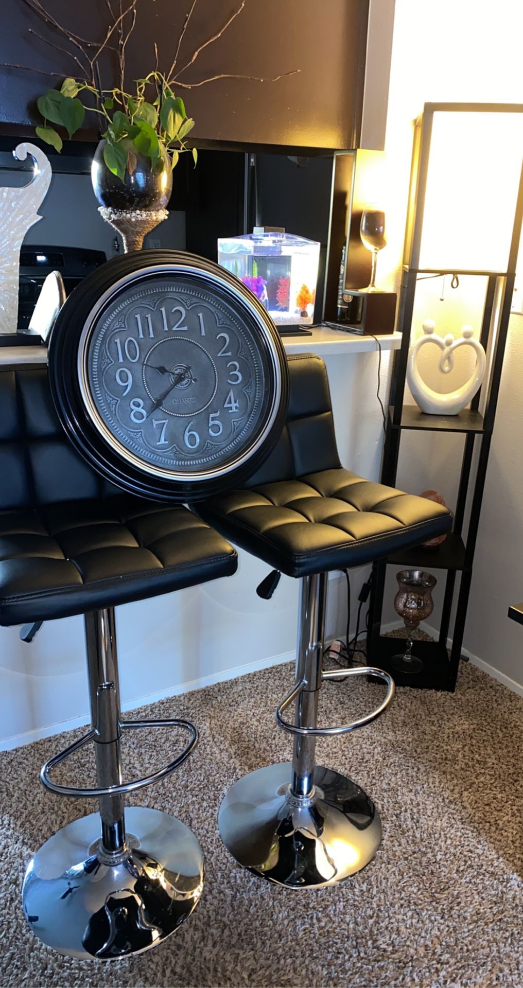 2 leather Bar stools chairs, a clock and a corner lamp.