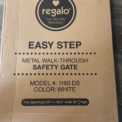 Brand new regalo white walk through baby gate 29-38.5”.  Brand new still sealed inside baby gate.   Has walk through door.  White metal.  Model 1160 D