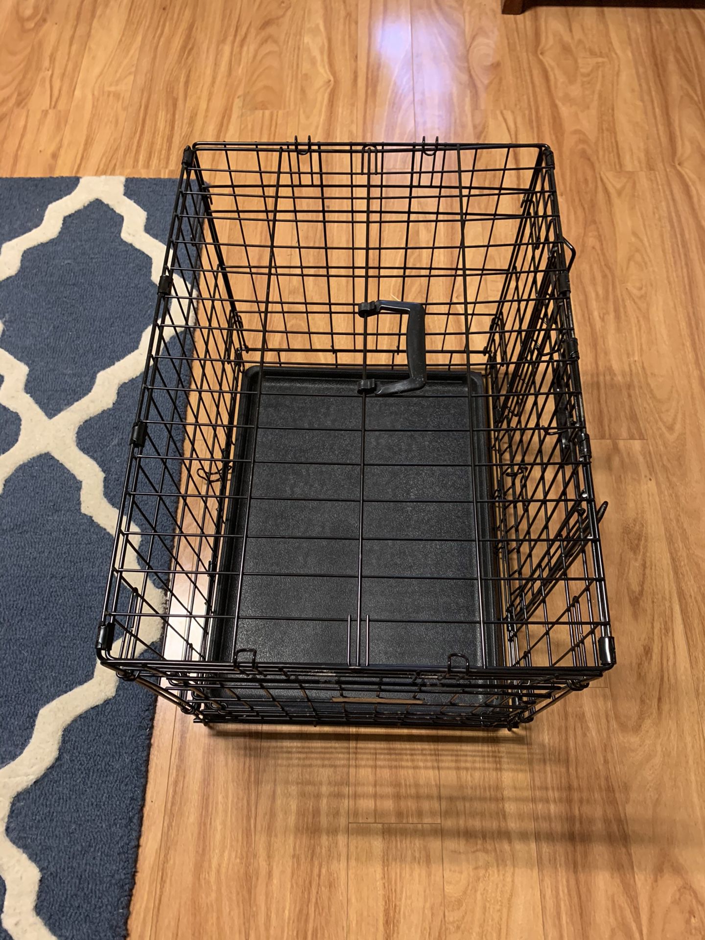 Small dog crate plus feeders.