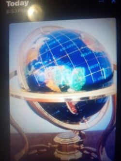 Gemstone inlaid world globe with brass tone stand and compass