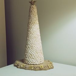 Nice Shell Tree On Brown Base With Gold Bows And Hold Star