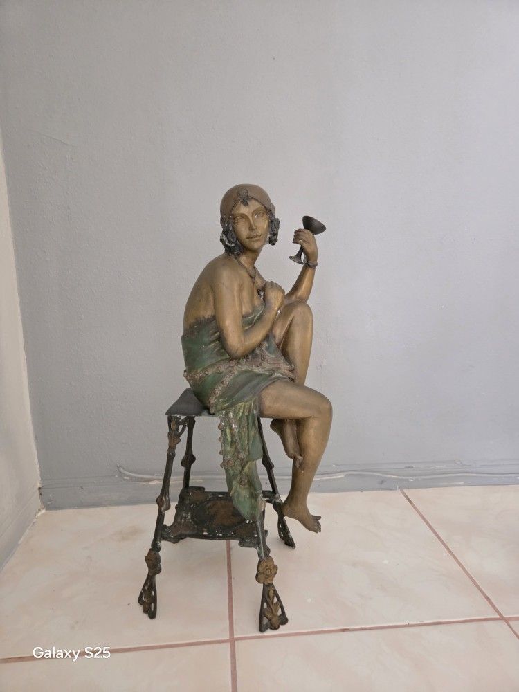 Antique solid brass doll.