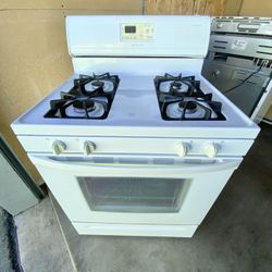 Whirlpool gas stove 4 burners white color. 30”