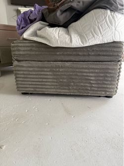 Gray chair. Converts to bed