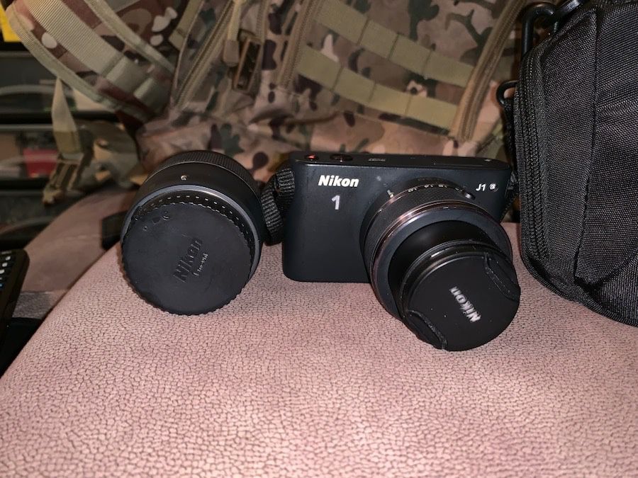 Nikon J1 camera with two lenses