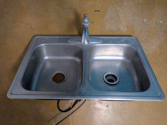Stainless kitchen sink with faucet