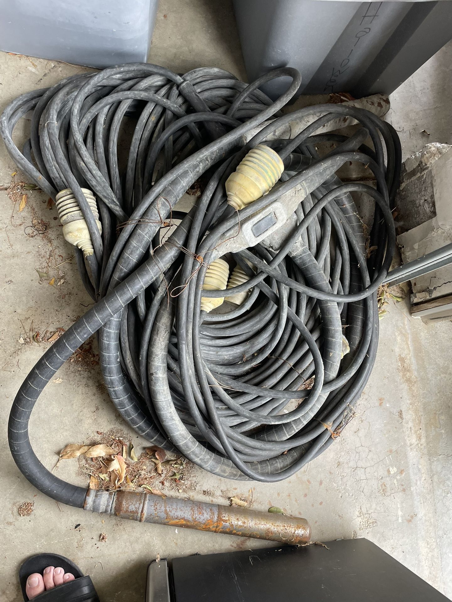 Two high cycle concrete vibrators with cords