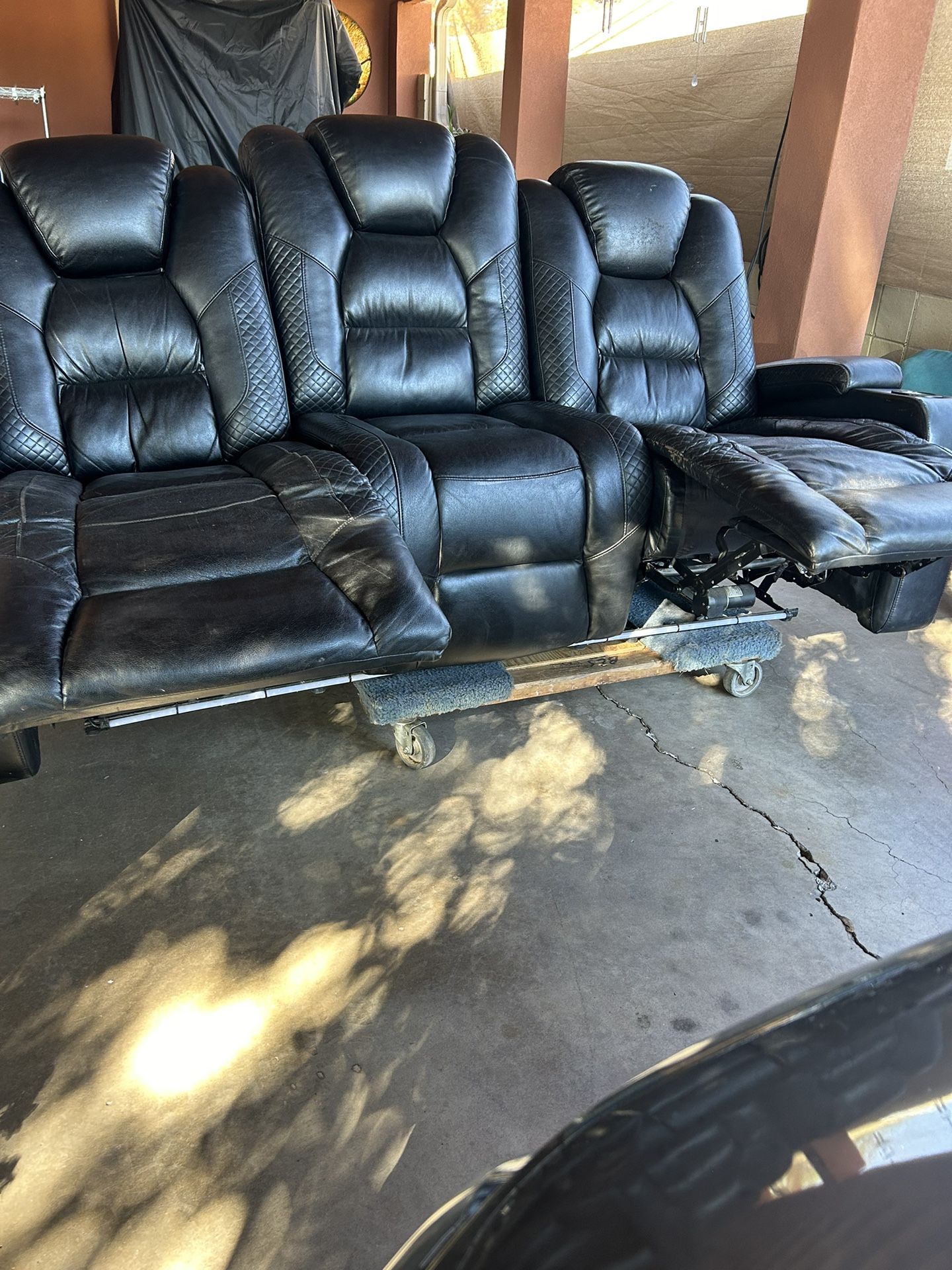 Electric Black Couch Both Seats Recline Console Has Two Outlets In the center Head Rest Has Function Lights 1 USB Outlet On Both Sides 