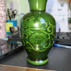 The Vintage Green Jade Malachite Glass Fragrance Vase by Avon is a decorative collectible piece that exudes elegance and charm. Made of glass with a s