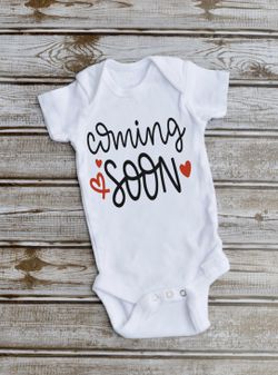 Pregnancy announcement onesie