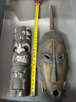 Four wooden outdoor tiki mask set
