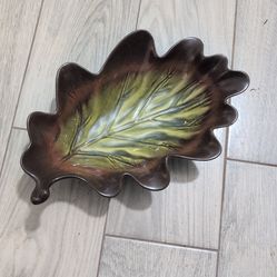 Home American Simplicity Stoneware leaf-shaped dish. It features a hand-painted brown and green glaze designed to resemble an oak leaf, complete with 