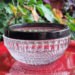 Vintage crystal or pressed glass bowl featuring a distinctive silver-plated rim.  5" Round