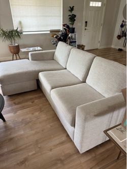 Sofa couch with reversible chaise and storage ottoman