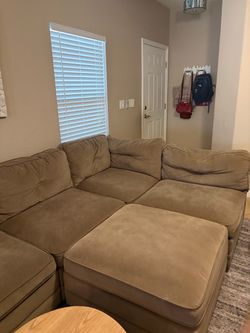Tan microfiber sectional sofa with 2 ottomans